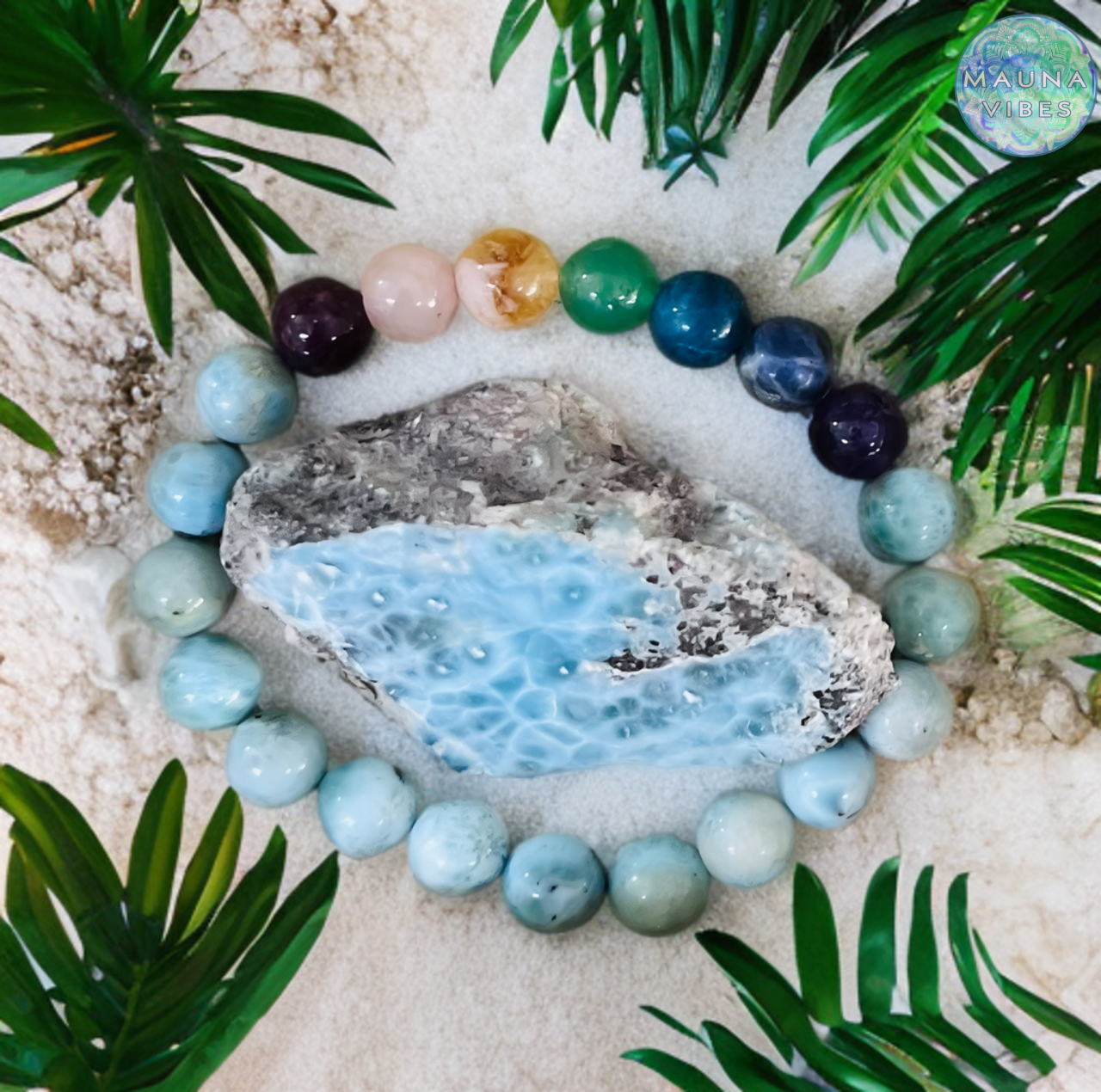 Handmade Larimar 7 Chakra Bracelet with 8mm natural gemstone beads, featuring Amethyst, Garnet, Citrine, Lapis Lazuli, Sodalite, Rose Quartz, and Apatite. Elastic, unisex design for energy balance, healing, and spiritual alignment. Exclusively crafted by Mauna Vibes.