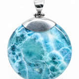 Large AAA Larimar round pendant in hand showing scale – 100g genuine Dominican Republic gemstone on sterling silver chain – Mauna Vibes