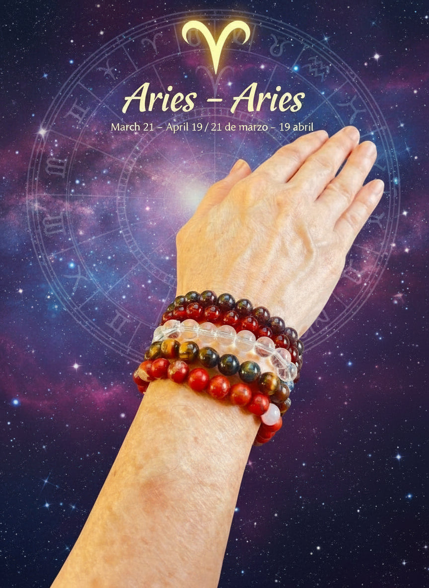 Hand wearing multiple bracelets with an Aries zodiac symbol in the background