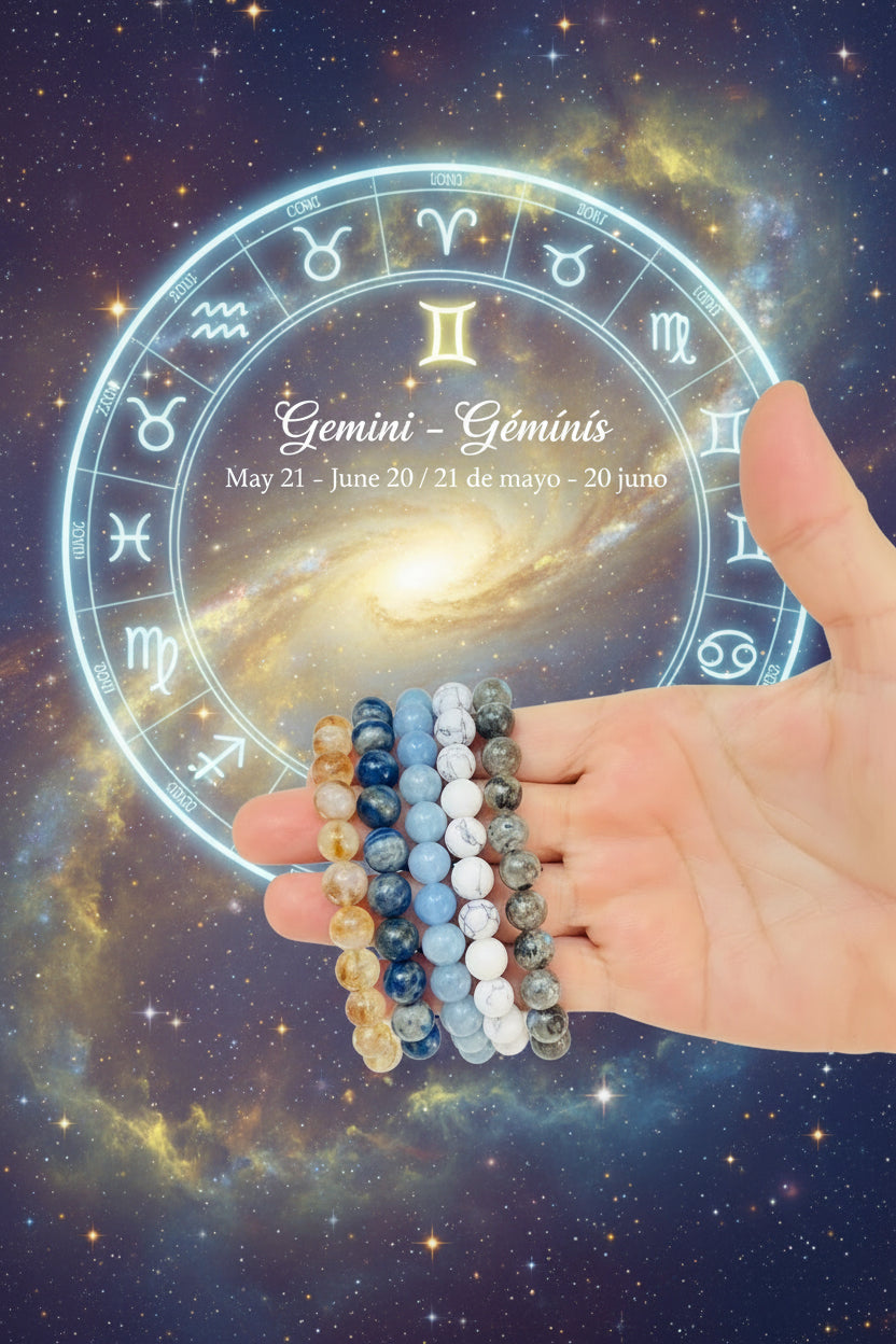 Hand holding three beaded bracelets with a natural background