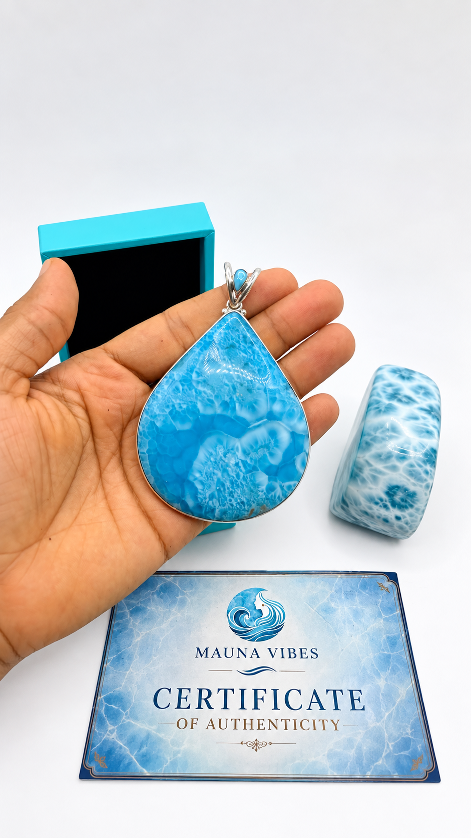 a large larimar stone teardrop pendant