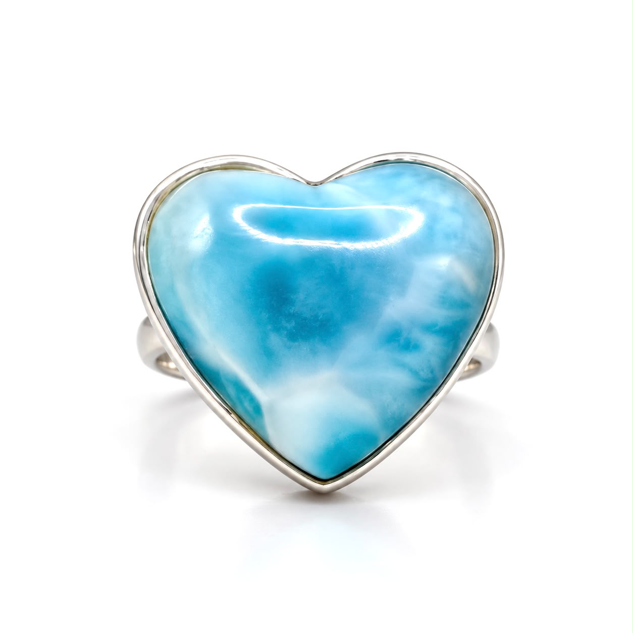 A heart-shaped Larimar ring with a polished silver bezel settin