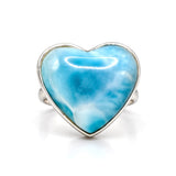 A heart-shaped Larimar ring with a polished silver bezel settin
