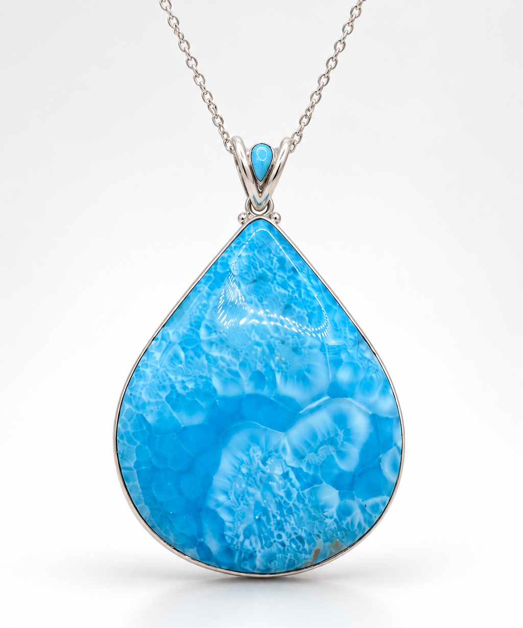 a high grade larimar pendant in teardrop shape