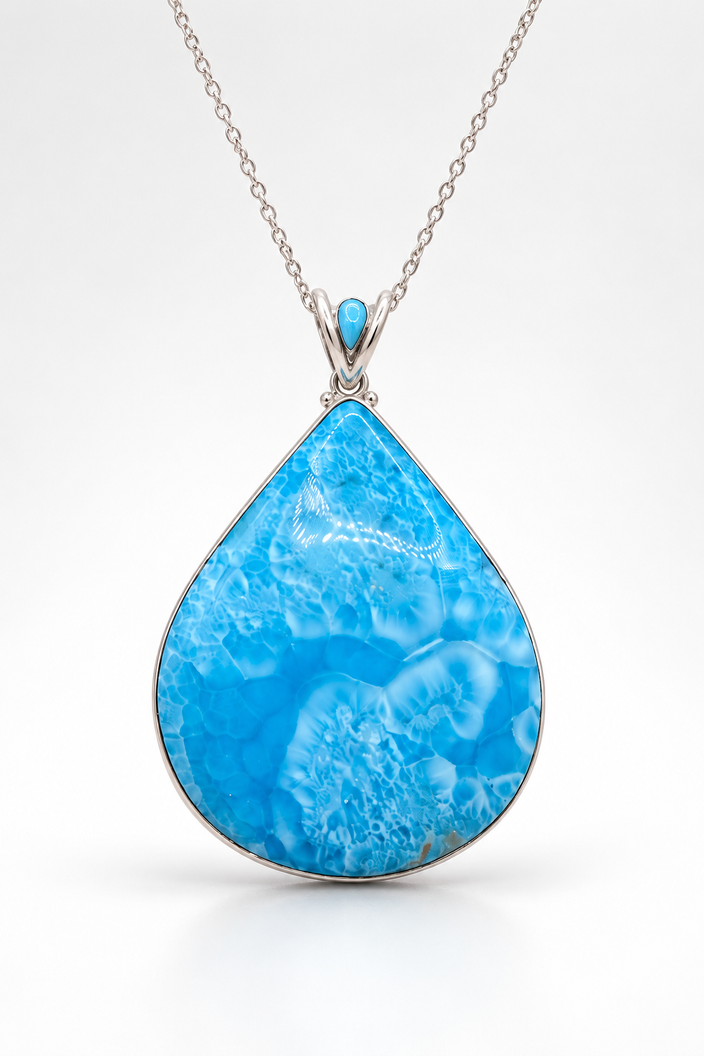 a high grade larimar pendant in teardrop shape