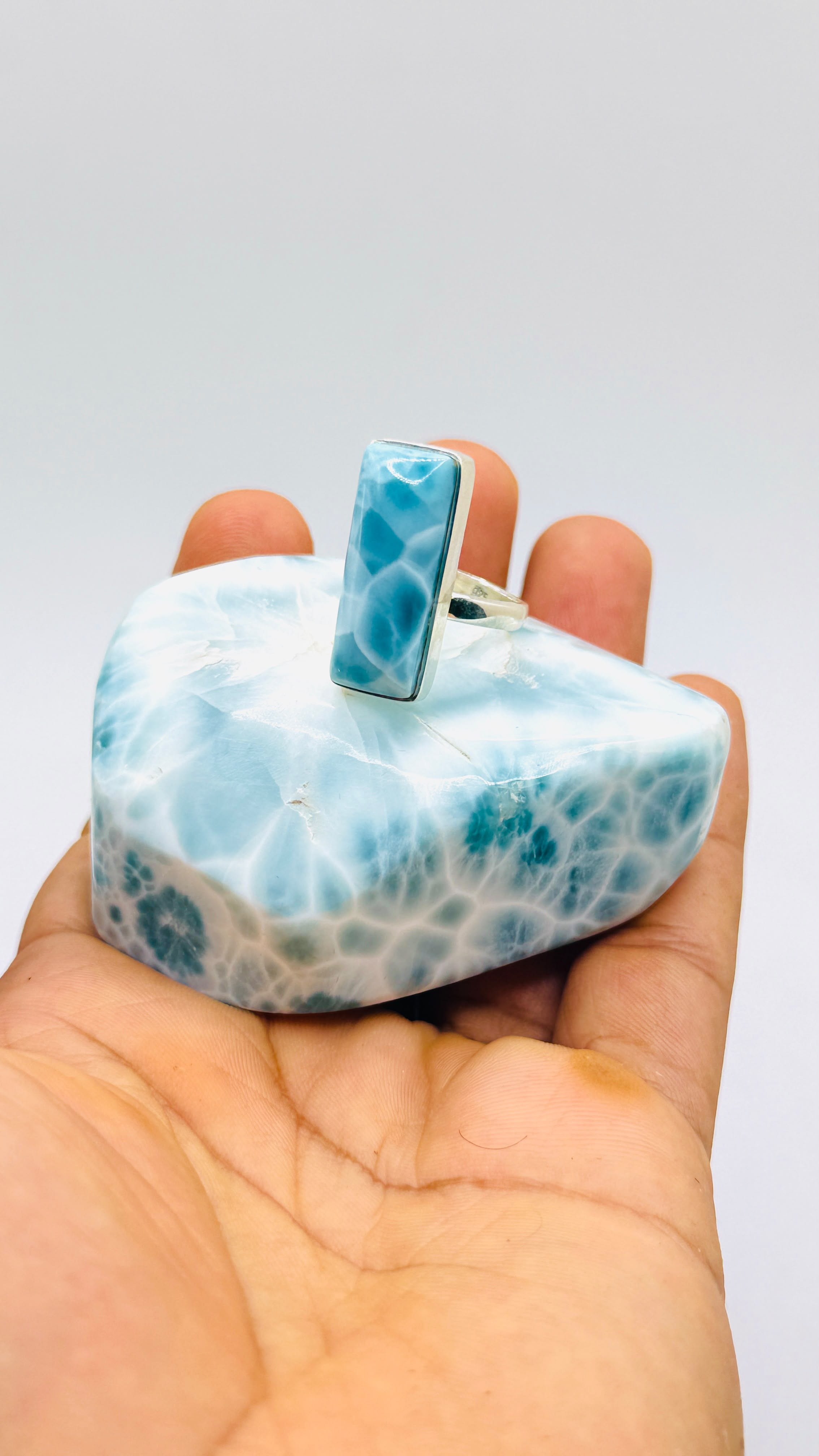 a high grade larimar 925 sterling silver ring on a polsihed larimar stone