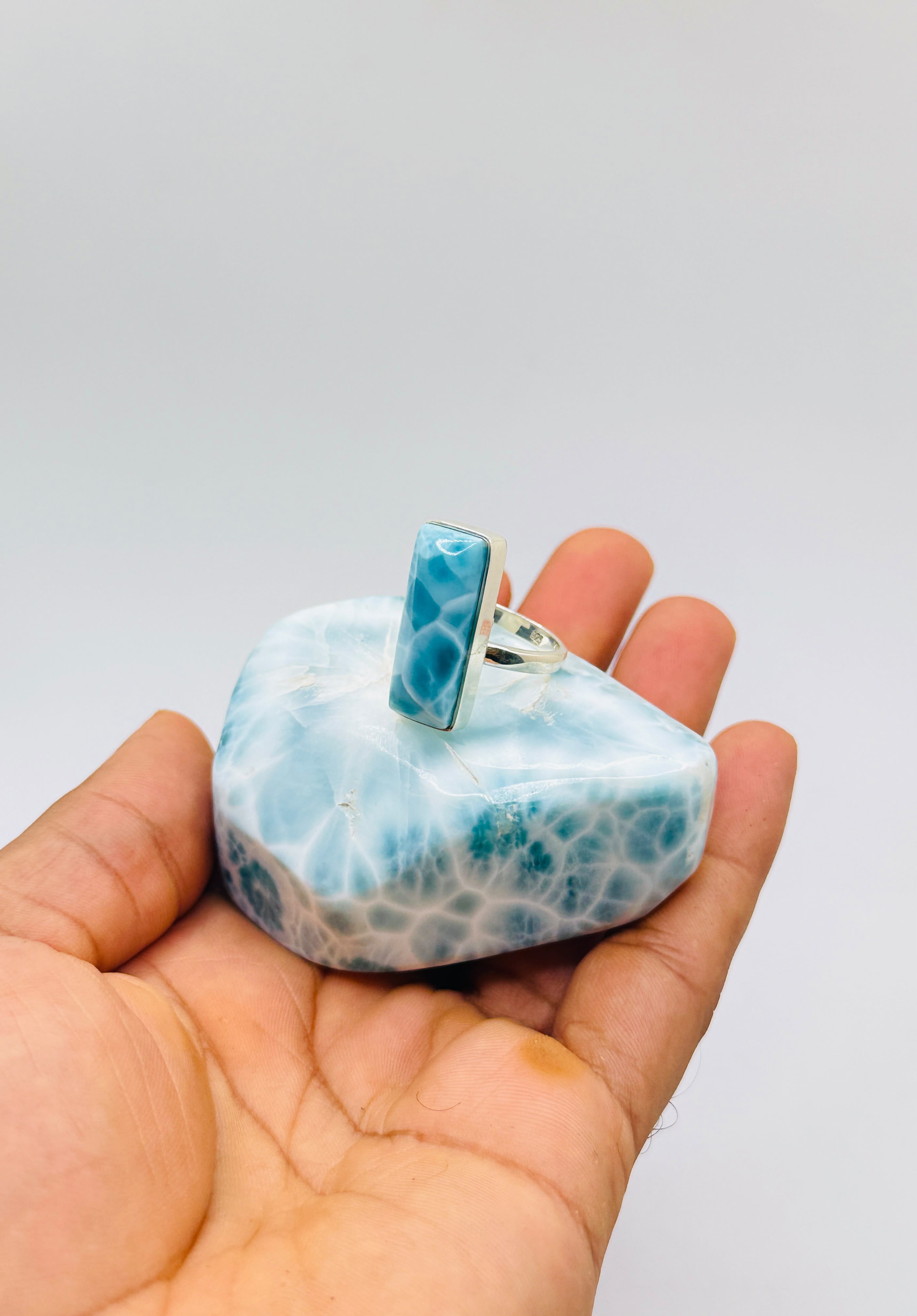 an adjustable larimar ring