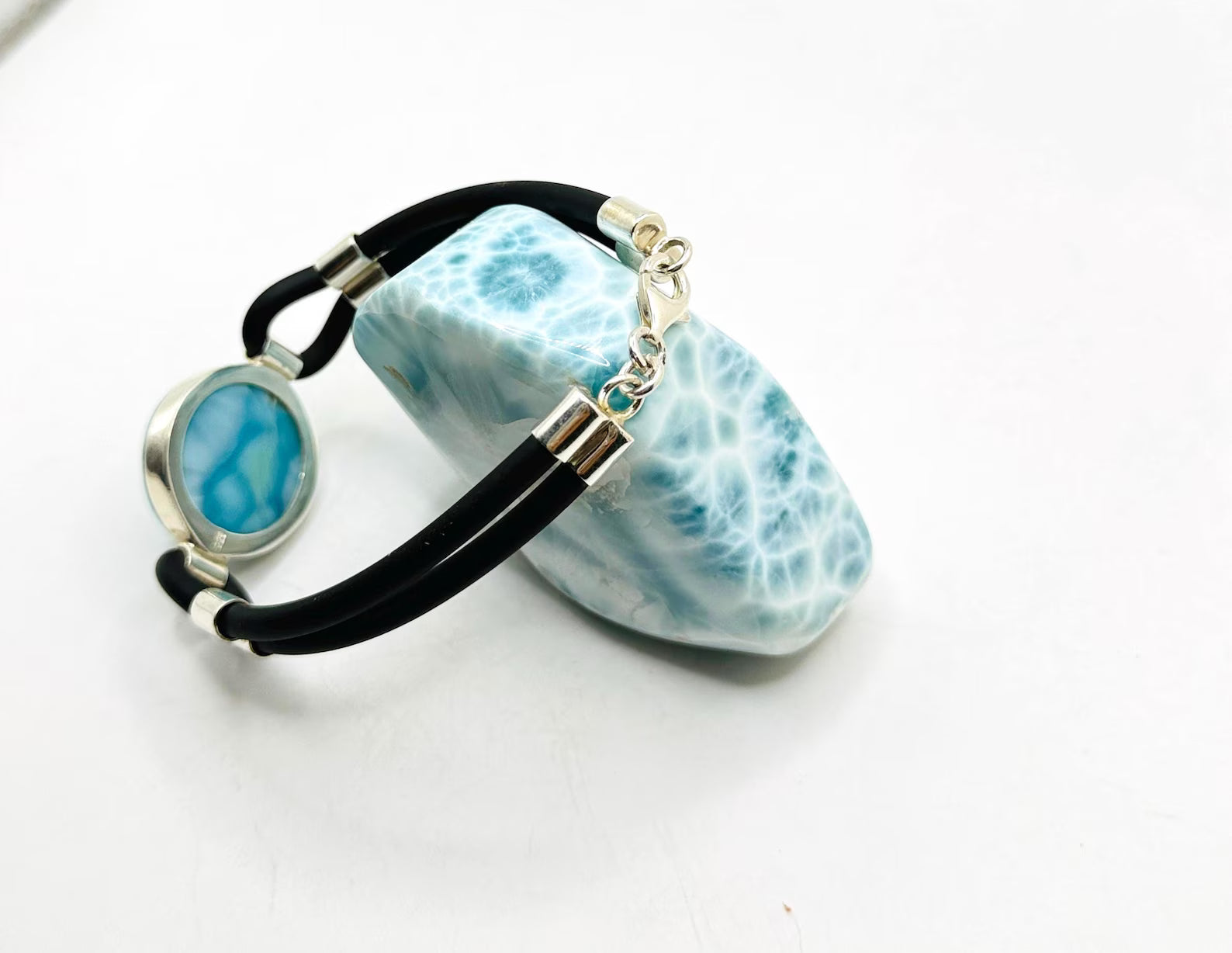 a black cord larimar bracelet