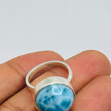A Larimar sterling silver ring with a round