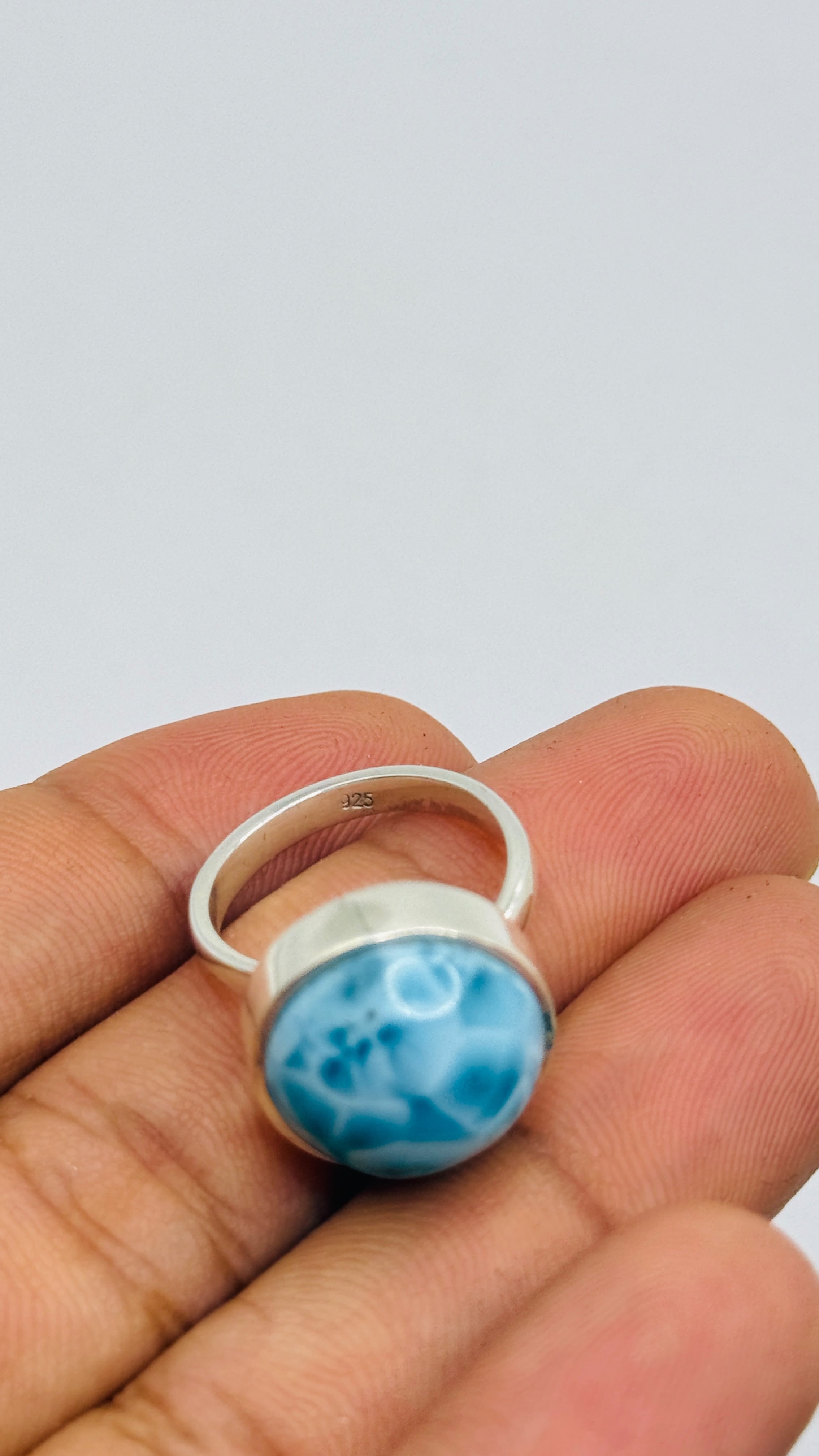 A Larimar sterling silver ring with a round