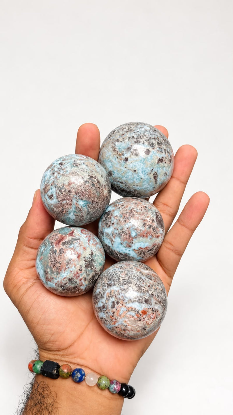 Rare Larimar Spheres with Iron Inclusions