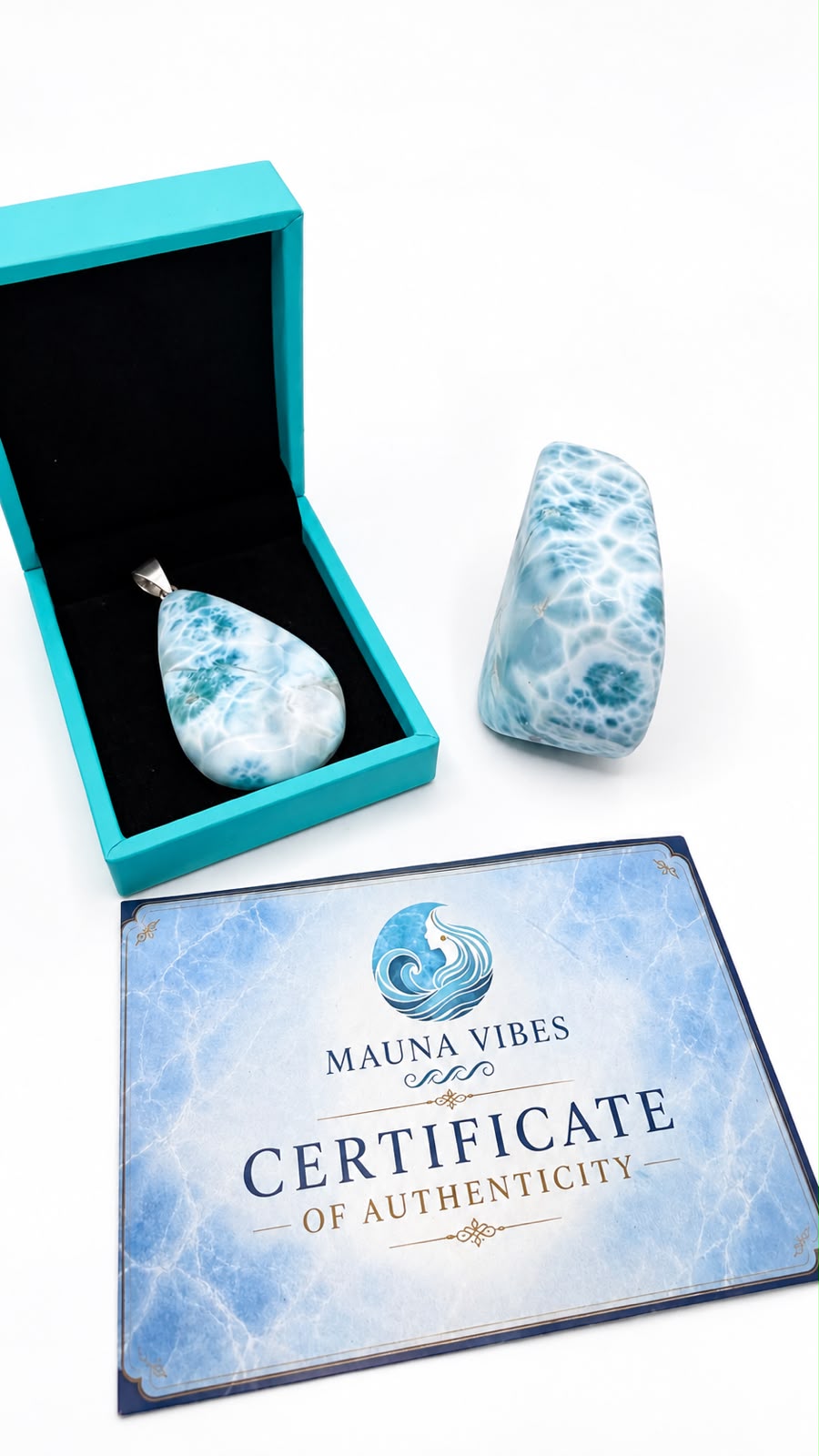 A teardrop-shaped marbled pendant in a turquoise box next to a matching polished stone, with a Certificate of Authenticity from Mauna Vibes on a white background.