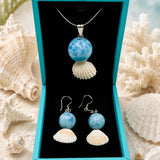 Larimar Pendant and earrings ina blue box
