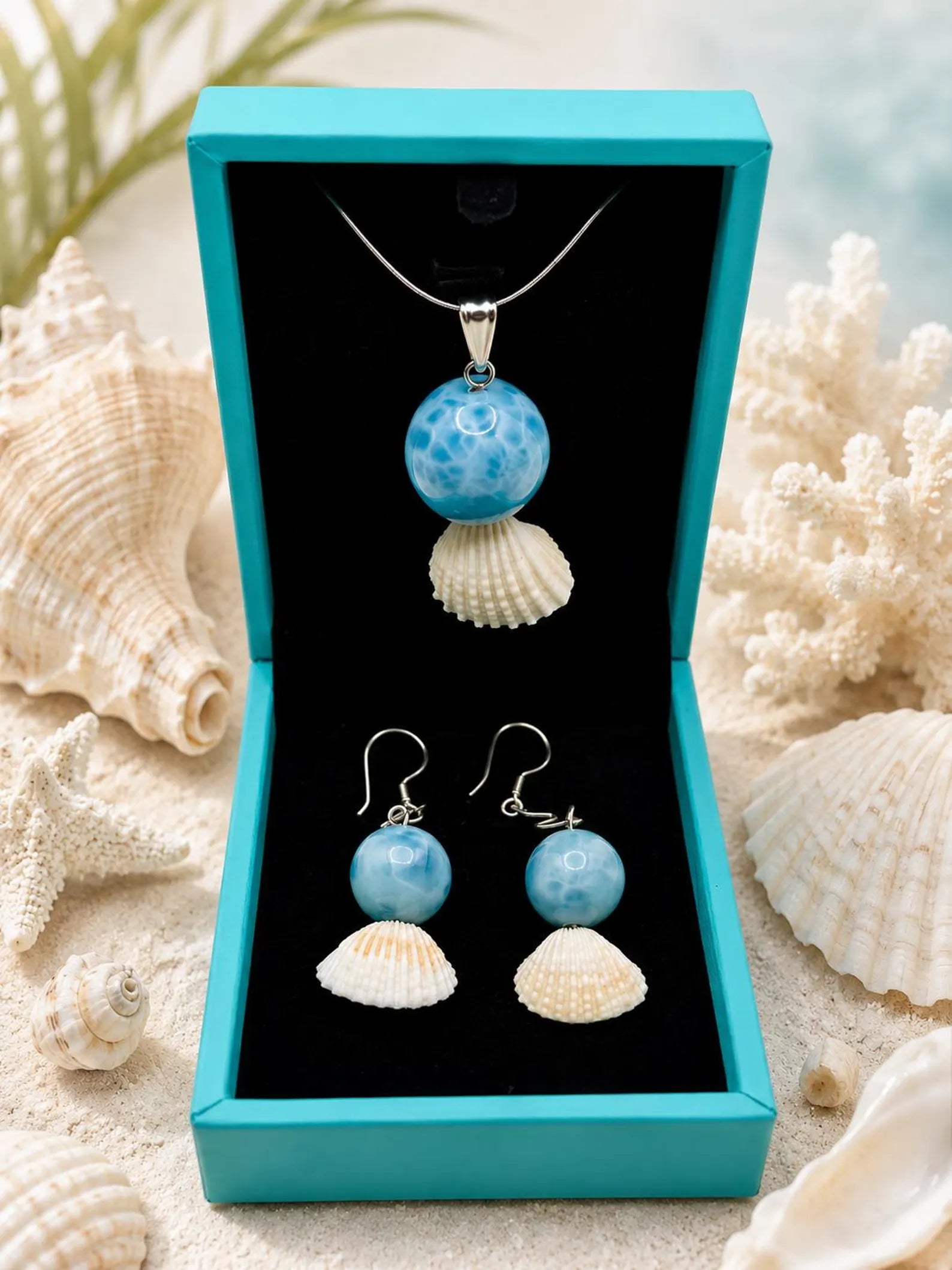 Larimar Pendant and earrings ina blue box
