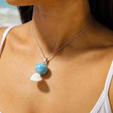 girl wearing larimar necklace and earrings
