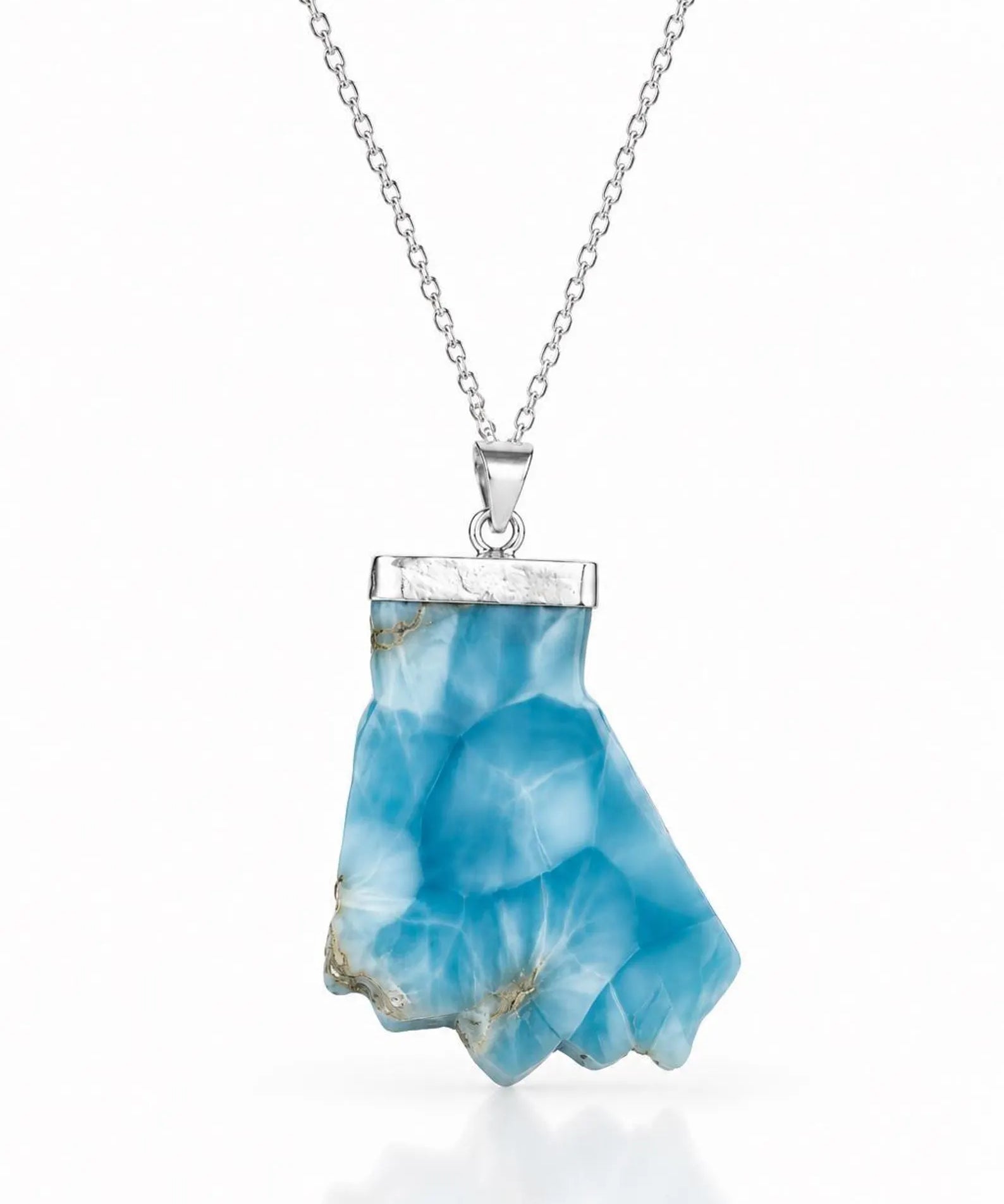 A silver necklace featuring a polished bluelarimar  crystal pendant with natural inclusions, suspended from a delicate silver chain against a white background.