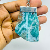 Larimar Stone Necklace on a Hand
