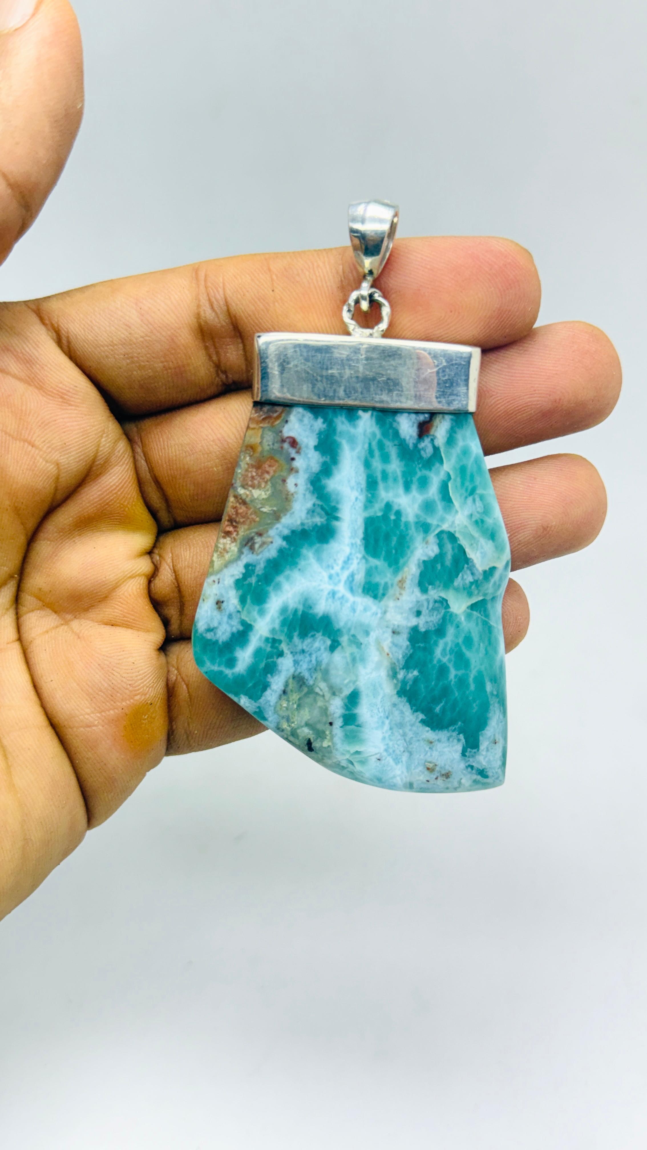 Larimar Stone Necklace on a Hand

