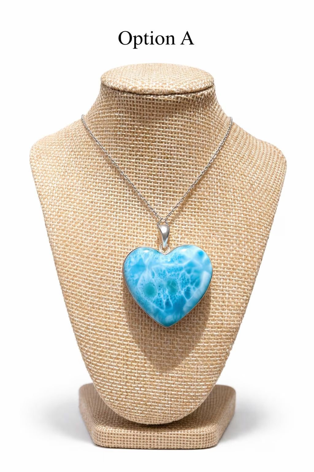 Larimar Necklace with a blue heart-shaped pendant on a beige mannequin bust.