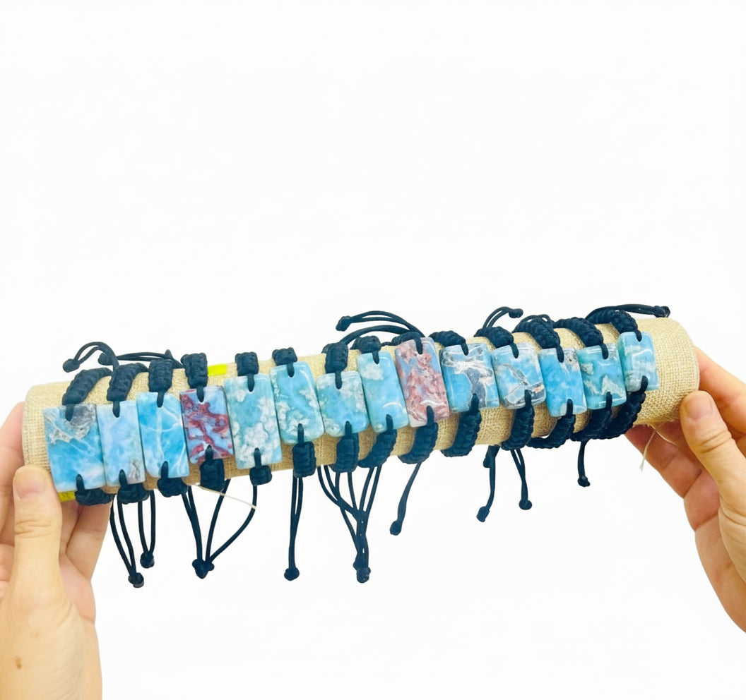 Handmade bracelets with colorful beads on a white background