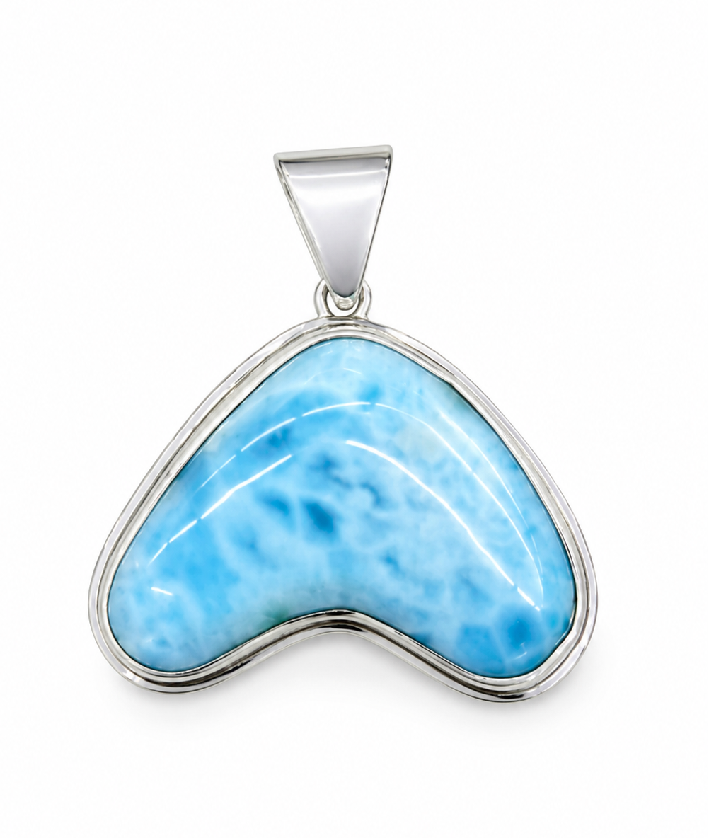 Blue larimar pendant with silver setting on a white background