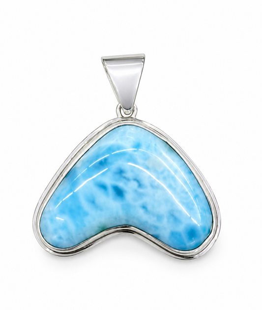 Blue larimar pendant with silver setting on a white background