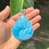 A Larimar Jewlery Pendant in natural sunlight 