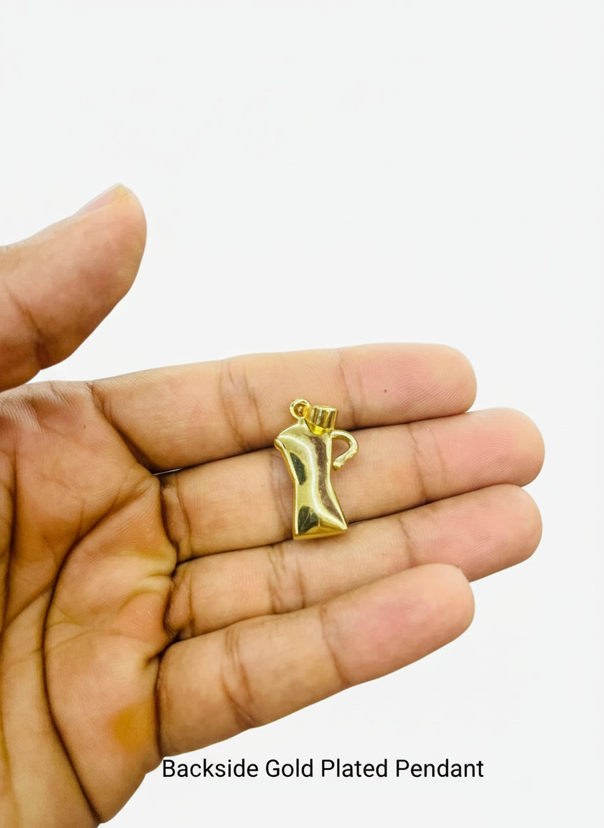 a hand holding Larimar gold coffe maker pendant 
