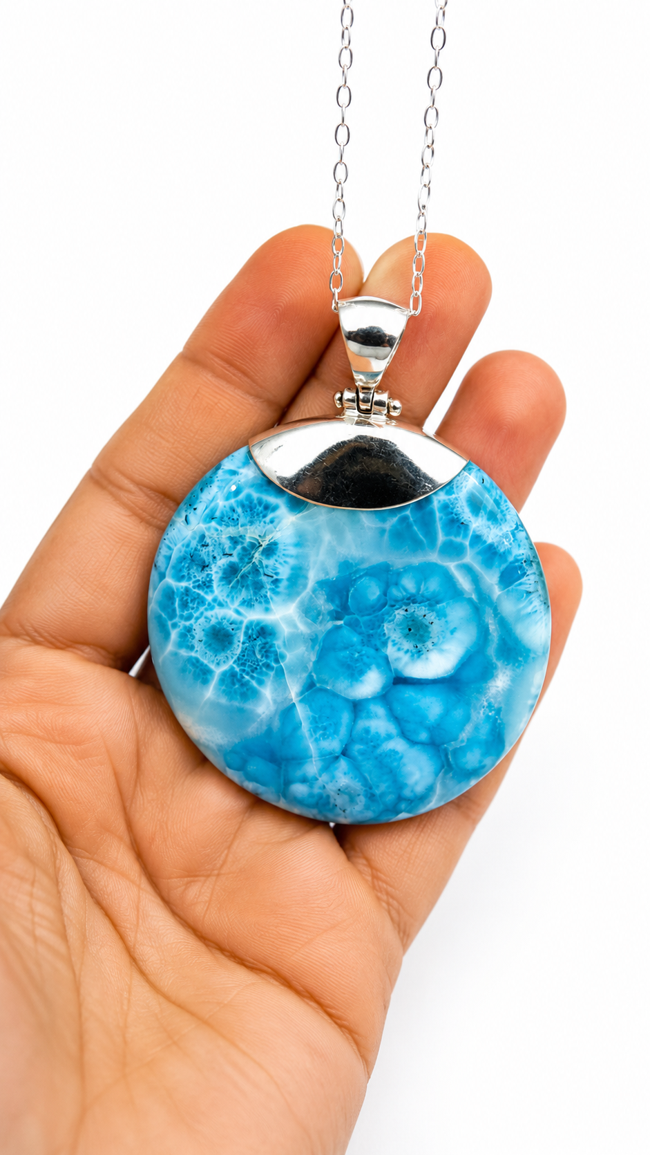 AAA Larimar round pendant in hand showing size – 100g genuine Dominican Republic gemstone on sterling silver chain – Mauna Vibes